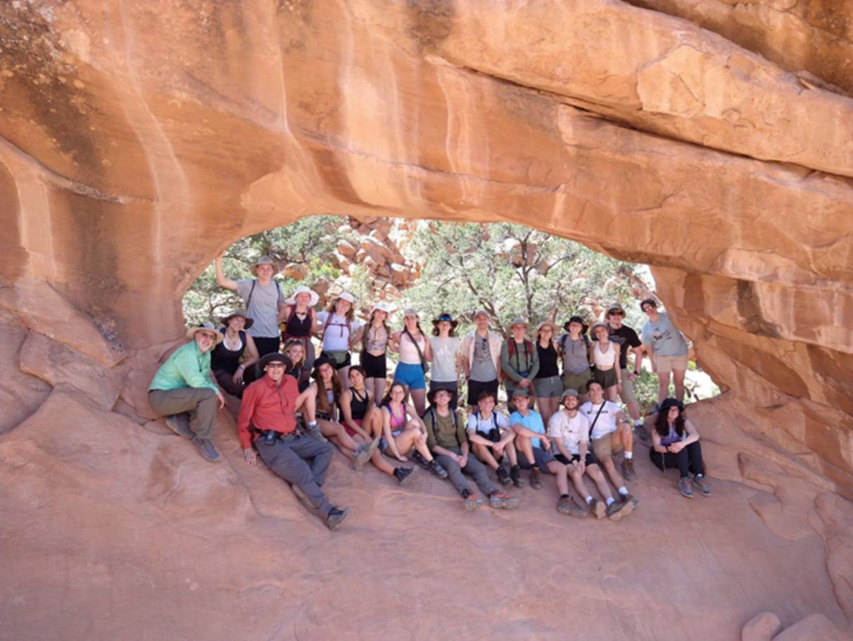 group photo inside a rocky enclosure